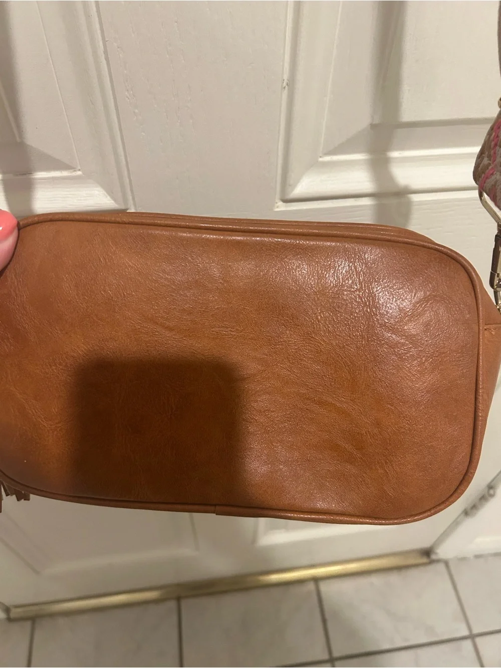 Tan Crossbody Camera Bag with Pink Patterned Strap and Tassel